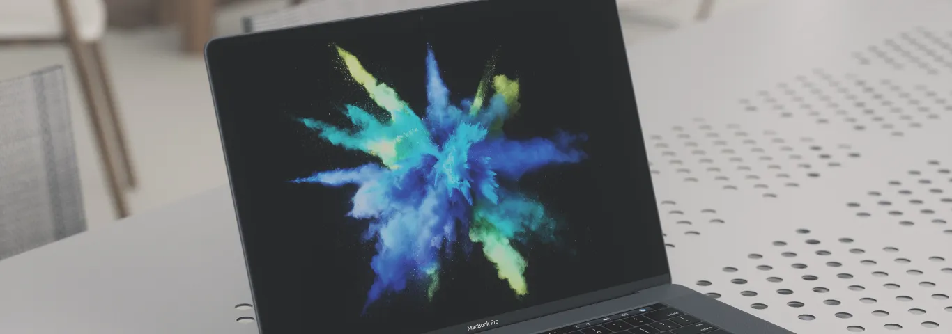 open macbook pro with colorburst screensaver