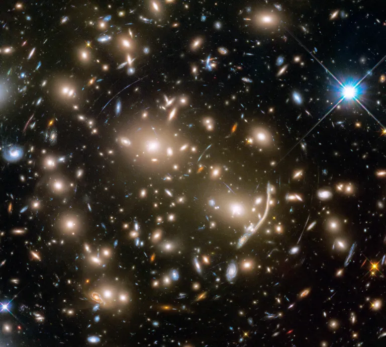 This Hubble Space Telescope mosaic shows a portion of the immense Coma galaxy cluster. This Hubble Space Telescope mosaic shows a portion of the immense Coma galaxy cluster — containing more than 1,000 galaxies — located 300 million light-years away. The 