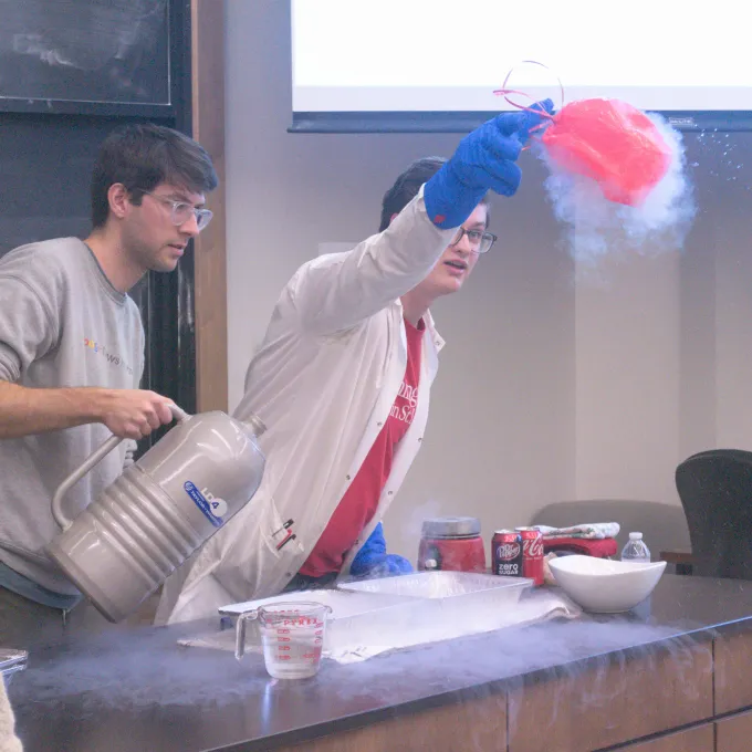 Grad students use liquid Nitrogen to demonstrate how gasses contract when exposed to extreme cold