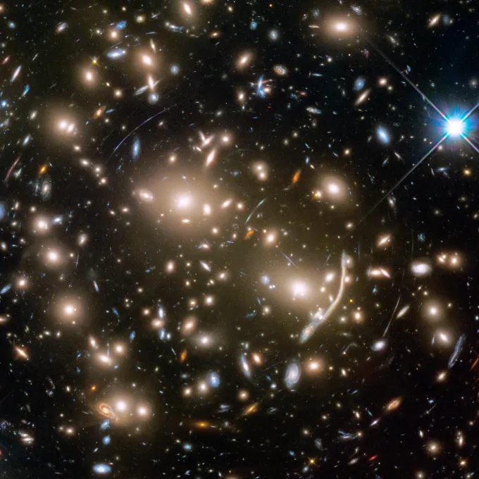This Hubble Space Telescope mosaic shows a portion of the immense Coma galaxy cluster. This Hubble Space Telescope mosaic shows a portion of the immense Coma galaxy cluster — containing more than 1,000 galaxies — located 300 million light-years away. The 